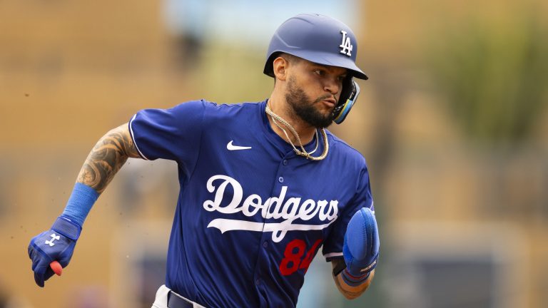 Andy Pages of the Los Angeles Dodgers runs to third base during the 2024 Spring Training Game between Los Angeles Dodgers and Colorado Rockies at Salt River Fields.