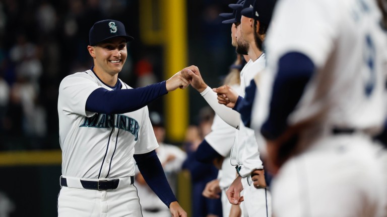 Dominic Canzone of the Seattle Mariners greets teammates on the field prior to the game between the Boston Red Sox and the Seattle Mariners at T-Mobile Park.