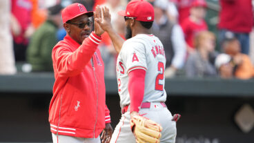 Manager Ron Washington of Los Angeles Angels celebrates a win with Luis Rengifo of the Los Angeles Angels during a baseball game at Oriole Park at Camden Yards.