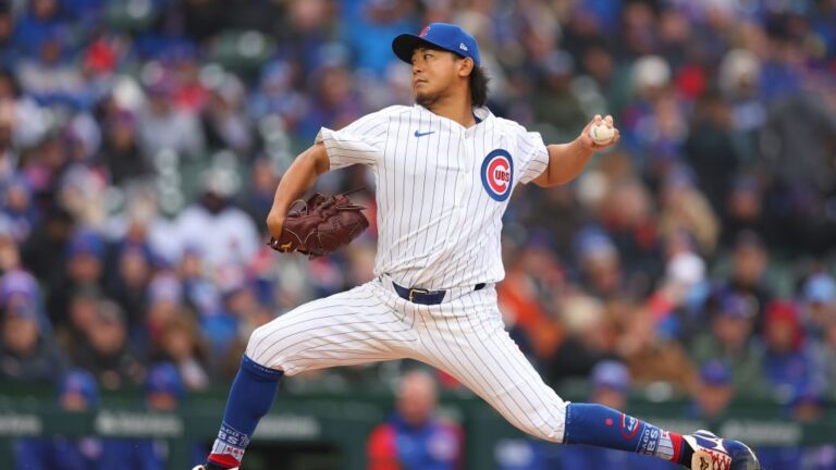 Shota Imanaga of the Chicago Cubs delivers a pitch in his MLB debut against the Colorado Rockies during the first inning at Wrigley Field.