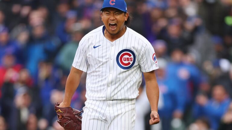 Shota Imanaga #18 of the Chicago Cubs celebrates after retiring the side in the sixth inning against the Colorado Rockies during his MLB debut at Wrigley Field.
