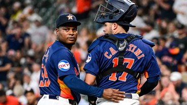 Victor Caratini and Framber Valdez of the Houston Astros look on against the Toronto Blue Jays at Minute Maid Park.