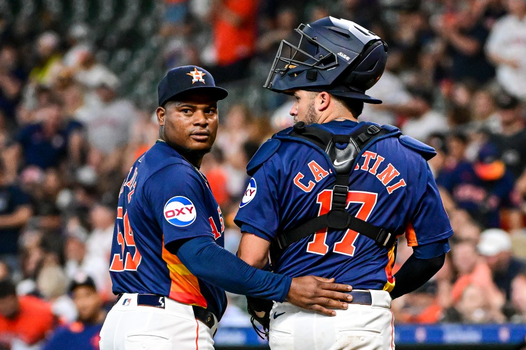 Victor Caratini and Framber Valdez of the Houston Astros look on against the Toronto Blue Jays at Minute Maid Park.