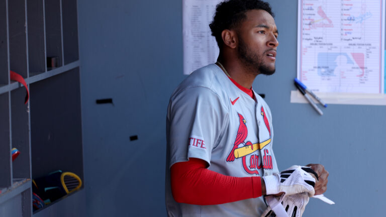Victor Scott II of the St. Louis Cardinals looks on the from dugout after his at bat in the eighth inning during the game between the St. Louis Cardinals and the Los Angeles Dodgers at Dodger Stadium.