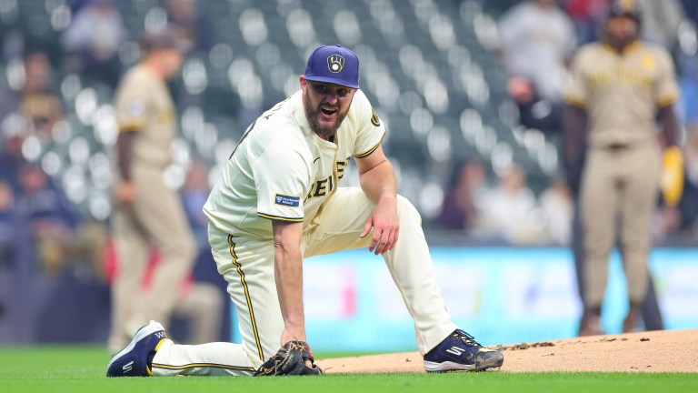 Wade Miley of the Milwaukee Brewers reacts after being hit by a ball during the first inning against the San Diego Padres at American Family Field.