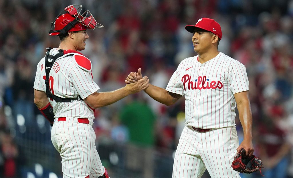 J.T. Realmuto #10 of the Philadelphia Phillies and Ranger Suarez #55 embrace after the game against the Colorado Rockies at Citizens Bank Park on April 16, 2024 in Philadelphia, Pennsylvania. The Phillies defeated the Rockies 5-0.
