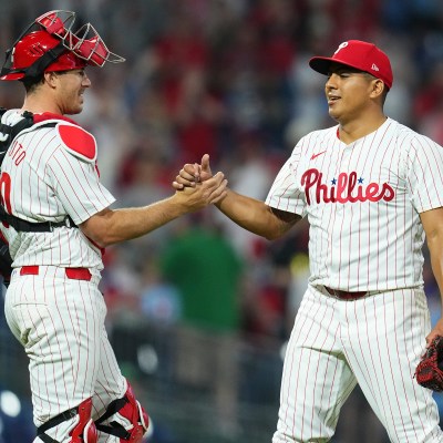 J.T. Realmuto #10 of the Philadelphia Phillies and Ranger Suarez #55 embrace after the game against the Colorado Rockies at Citizens Bank Park on April 16, 2024 in Philadelphia, Pennsylvania. The Phillies defeated the Rockies 5-0.