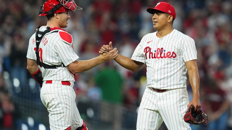 J.T. Realmuto #10 of the Philadelphia Phillies and Ranger Suarez #55 embrace after the game against the Colorado Rockies at Citizens Bank Park on April 16, 2024 in Philadelphia, Pennsylvania. The Phillies defeated the Rockies 5-0.