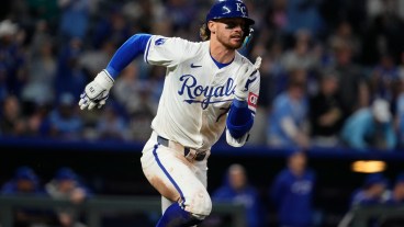 Bobby Witt Jr. of the Kansas City Royals runs to first after hitting against the Toronto Blue Jays at Kauffman Stadium.