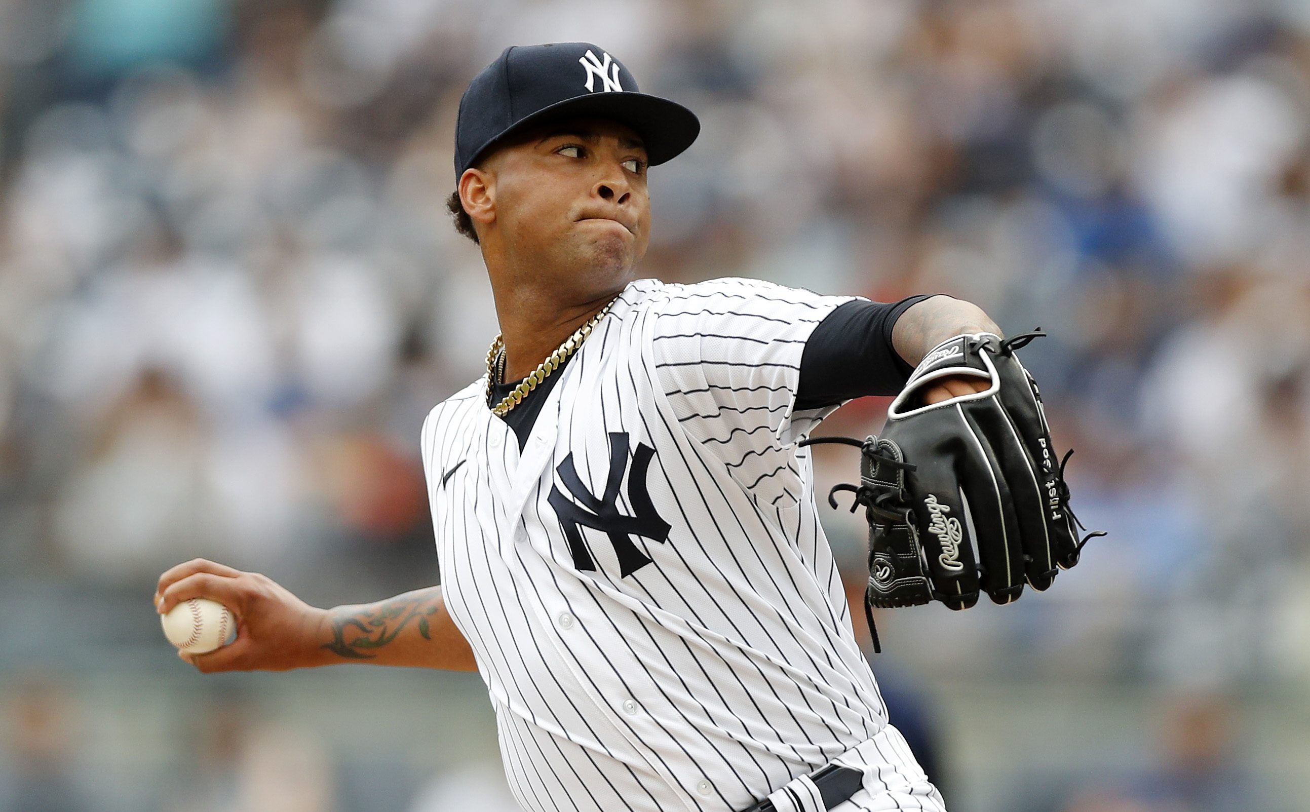 Luis Gil of the New York Yankees pitches during the second inning against the Seattle Mariners at Yankee Stadium.