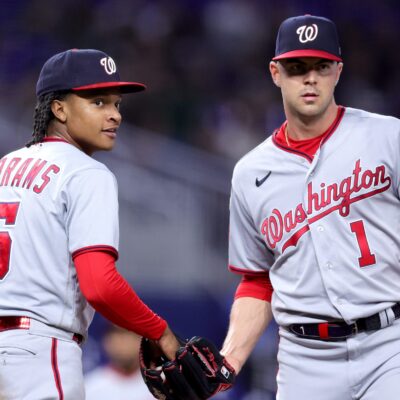 CJ Abrams #5 and MacKenzie Gore #1 of the Washington Nationals look on against the Miami Marlins during the fourth inning at loanDepot Park.