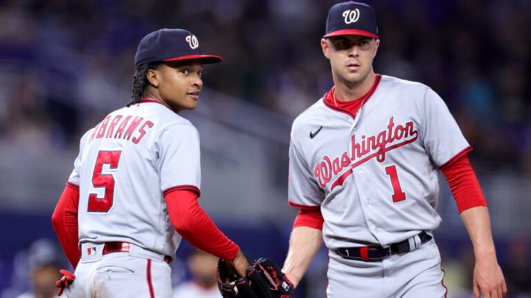 CJ Abrams #5 and MacKenzie Gore #1 of the Washington Nationals look on against the Miami Marlins during the fourth inning at loanDepot Park.