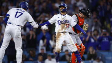 Mookie Betts of the Los Angeles Dodgers celebrates a home run with Shohei Ohtani against the San Francisco Giants.