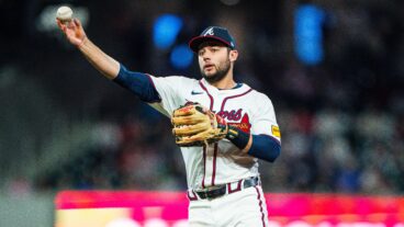 David Fletcher of Atlanta Braves makes a throw to first during the seventh inning against the Miami Marlins at Truist Park.
