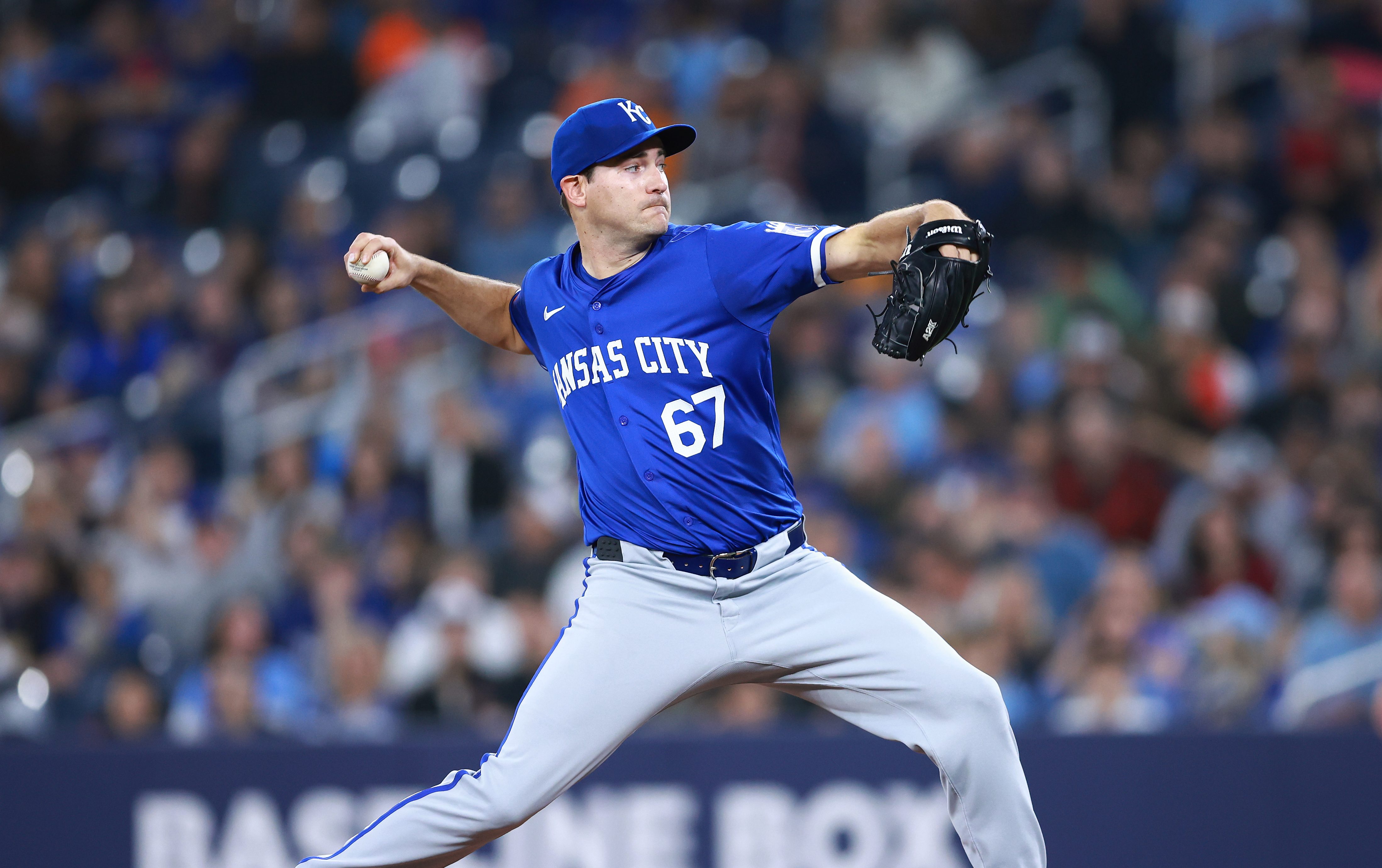 Seth Lugo #67 of the Kansas City Royals delivers a pitch in the first inning during a game against the Toronto Blue Jays at Rogers Centre.