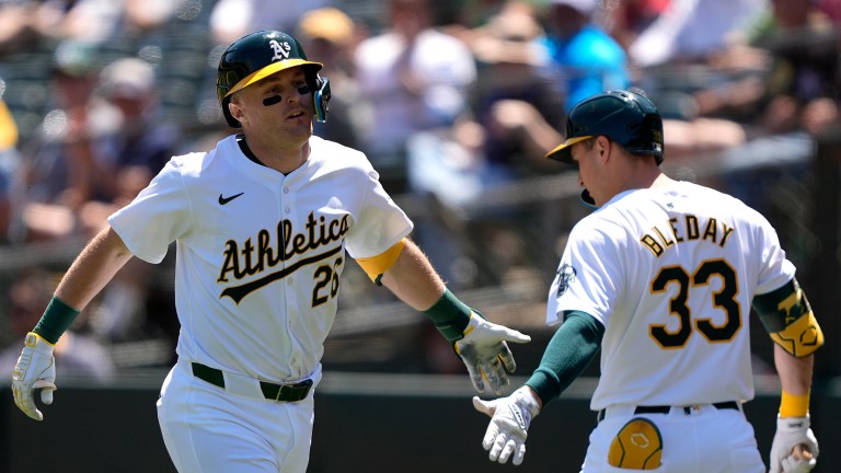 Tyler Nevin #26 of the Oakland Athletics is congratulated by JJ Bleday #33 after Nevin hit a solo home run against the Pittsburgh Pirates in the bottom of the third inning on May 1, 2024 at the Oakland Coliseum.