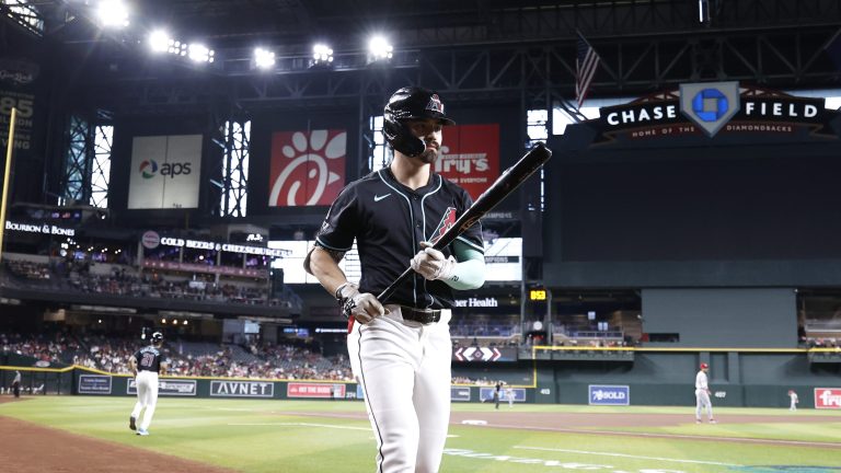 Corbin Carroll of the Arizona Diamondbacks warms up in the on deck circle during the game against the Cincinnati Reds at Chase Field.