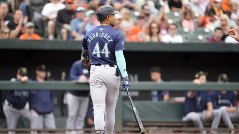 Julio Rodríguez of the Seattle Mariners walks back to the dug out after striking out in the first inning during a baseball game against the Baltimore Orioles at Oriole Park at Camden Yards.
