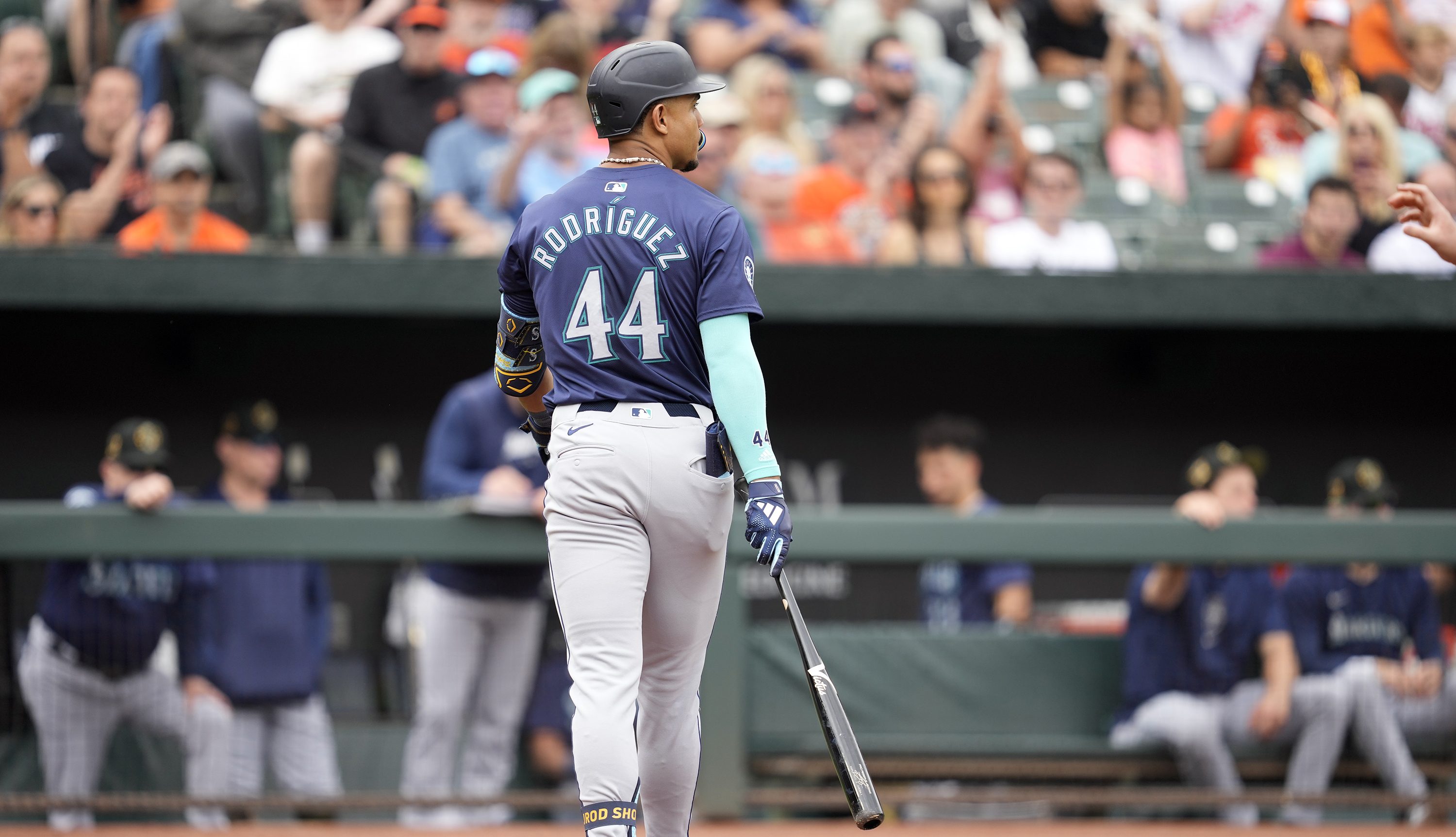 Julio Rodríguez of the Seattle Mariners walks back to the dug out after striking out in the first inning during a baseball game against the Baltimore Orioles at Oriole Park at Camden Yards.