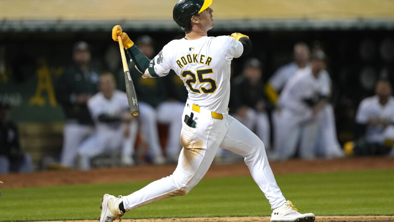 Brent Rooker of the Oakland Athletics bats against the Colorado Rockies in the bottom of the seventh inning at the Oakland Coliseum.