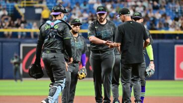 Aaron Civale #34 of the Tampa Bay Rays is relieved by manager Kevin Cash.