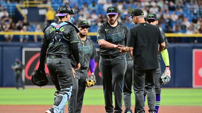 Aaron Civale #34 of the Tampa Bay Rays is relieved by manager Kevin Cash.