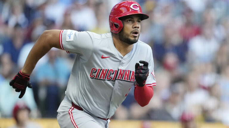 Jeimer Candelario of the Cincinnati Reds hits a double in the first inning against the Milwaukee Brewers at American Family Field.