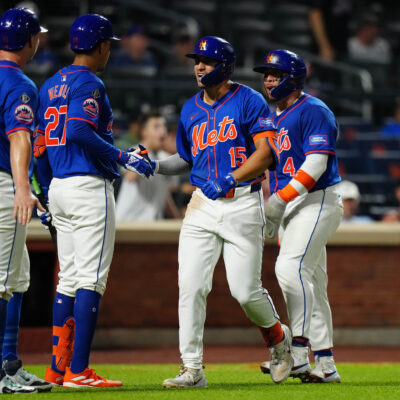 Tyrone Taylor #15 of the New York Mets celebrates with Pete Alonso #20, Mark Vientos #27 and Francisco Alvarez #4 after hitting a three RBI home run in the sixth inning during the game between the New York Yankees and the New York Mets.