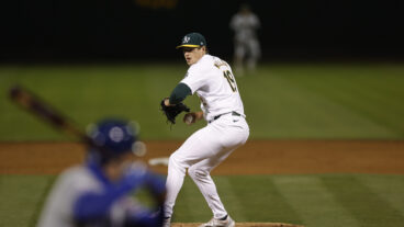 Mason Miller of the Oakland Athletics pitches during the game against the Kansas City Royals at the Oakland Coliseum.