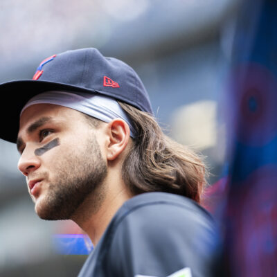 Bo Bichette #11 of Toronto Blue Jays looks on from the dugout before playing the Houston Astros in their MLB game at the Rogers Centre.