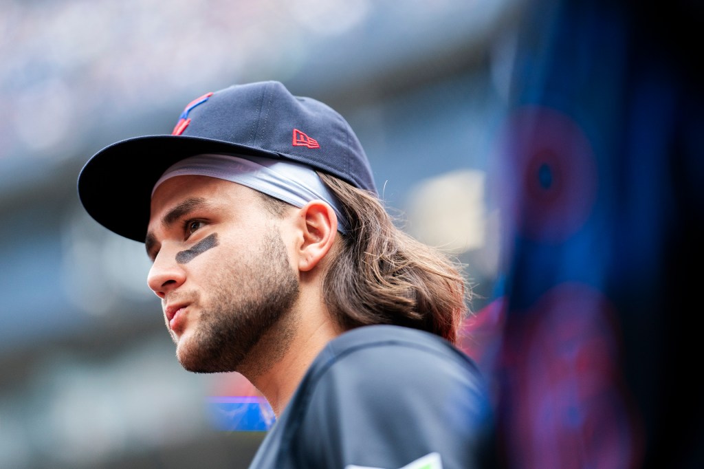 Bo Bichette #11 of Toronto Blue Jays looks on from the dugout before playing the Houston Astros in their MLB game at the Rogers Centre.