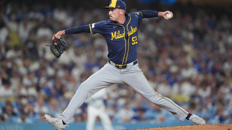 Bryan Hudson of the Milwaukee Brewers pitches against the Los Angeles Dodgers during the seventh inning at Dodger Stadium.