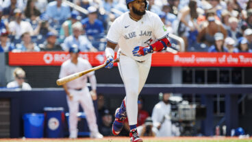 TORONTO, CANADA - JULY 20: Vladimir Guerrero Jr. #27 of the Toronto Blue Jays runs out a single in the first inning of their MLB game against the Detroit Tigers at Rogers Centre on July 20, 2024 in Toronto, Ontario, Canada. (Photo by Cole Burston/Getty Images)
