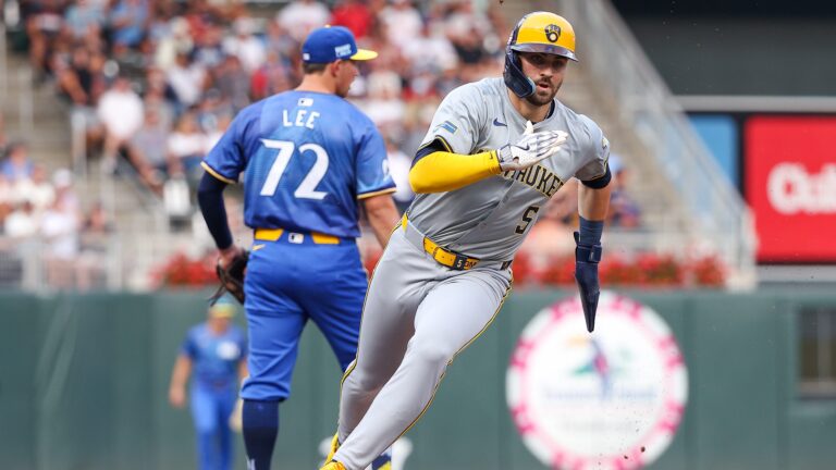 Garrett Mitchell of the Milwaukee Brewers rounds third base on a RBI single hit by Jackson Chourio during the third inning against the Minnesota Twins at Target Field.