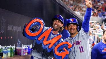 Jeff McNeil of the New York Mets celebrates with teammate Jose Iglesias after hitting a home run against the Miami Marlins during the sixth inning of the game at loanDepot Park.