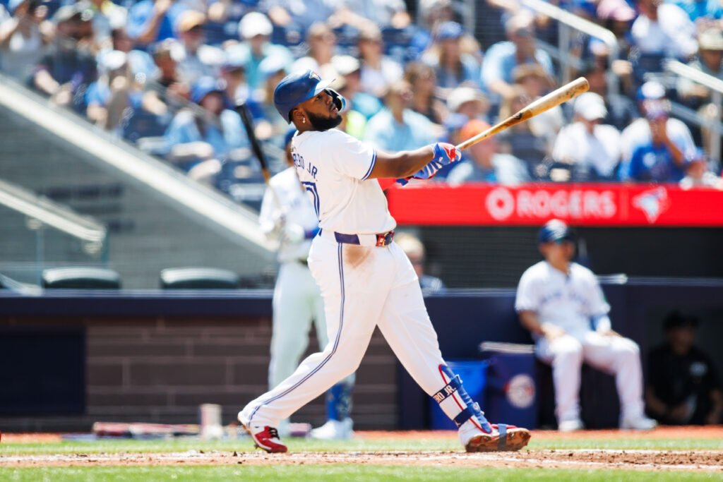 Vladimir Guerrero Jr. of the Toronto Blue Jays hits a solo home run in the third inning of their MLB game against the Texas Rangers at Rogers Centre.