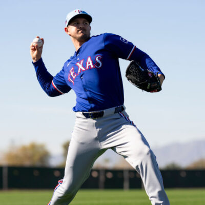 Tyler Mahle of the Texas Rangers warms up during a spring training workout at Surprise Stadium.