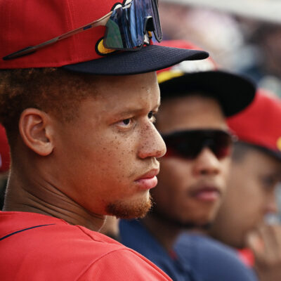 Outfield and second base prospect Kristian Campbell watches the action from the bench.