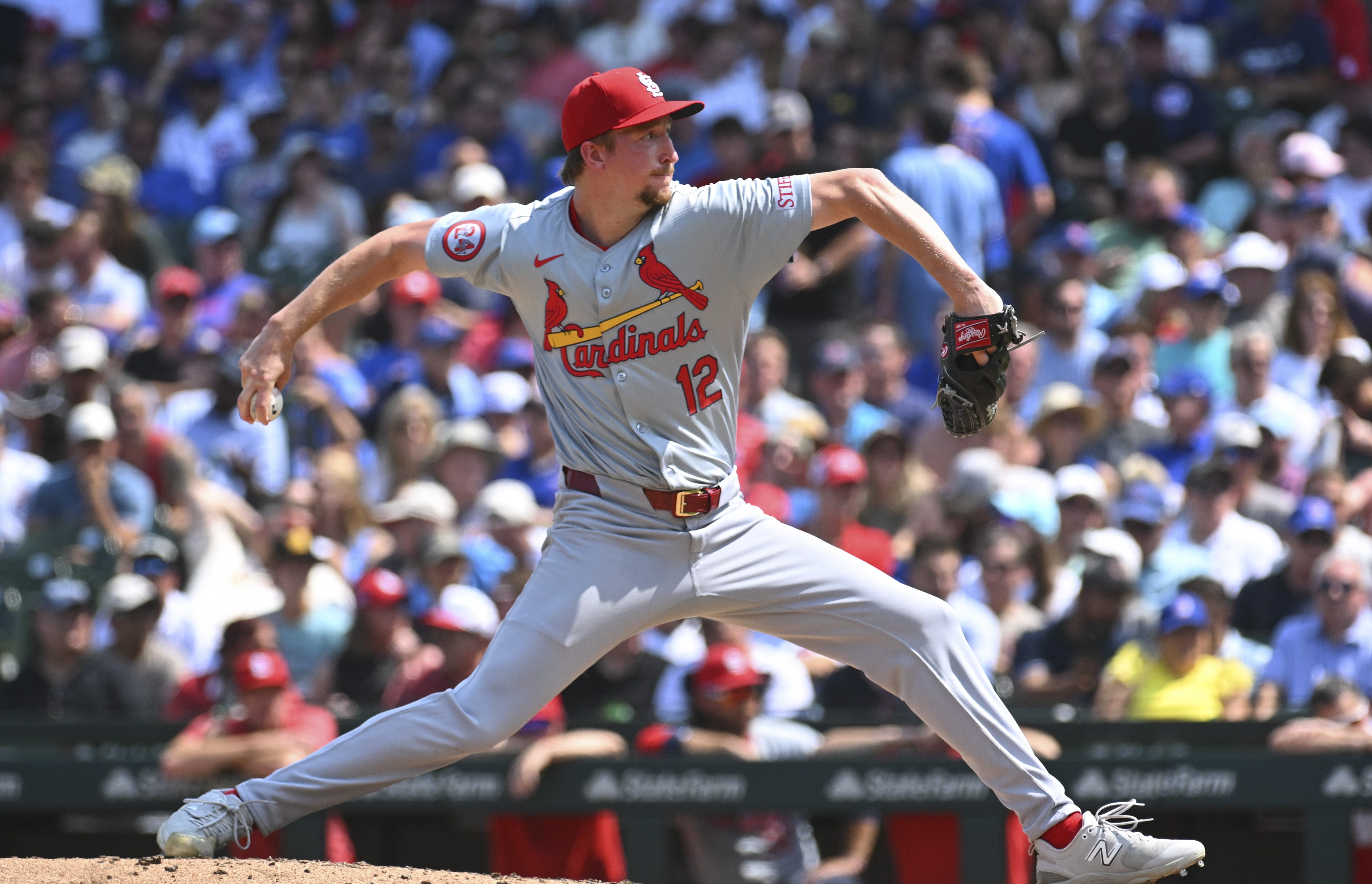 Erick Fedde #12 of the St. Louis Cardinals throws a pitch during the third inning of a game against the Chicago Cubs at Wrigley Field.