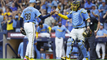 MILWAUKEE, WI - AUGUST 17: Milwaukee Brewers pitcher Devin Williams (38) celebrates his save with Milwaukee Brewers catcher Gary Sánchez (99) during a game between the Milwaukee Brewers and the Cleveland Guardians on August 17, 2024 at American Family Field in Milwaukee, WI. (Photo by Larry Radloff/Icon Sportswire via Getty Images)