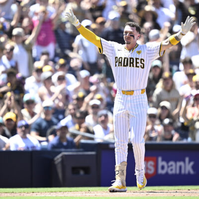 Jackson Merrill of the San Diego Padres celebrates after hitting a two-RBI triple against the Pittsburgh Pirates.