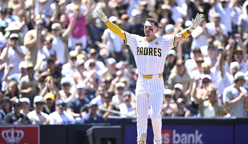 Jackson Merrill of the San Diego Padres celebrates after hitting a two-RBI triple against the Pittsburgh Pirates.