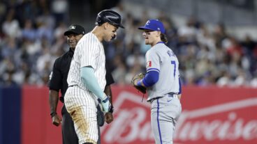 Bobby Witt Jr. #7 of the Kansas City Royals in action against Aaron Judge #99 of the New York Yankees at Yankee Stadium.