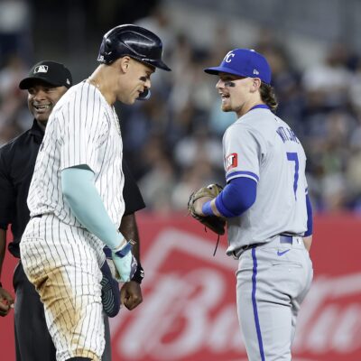 Bobby Witt Jr. #7 of the Kansas City Royals in action against Aaron Judge #99 of the New York Yankees at Yankee Stadium.