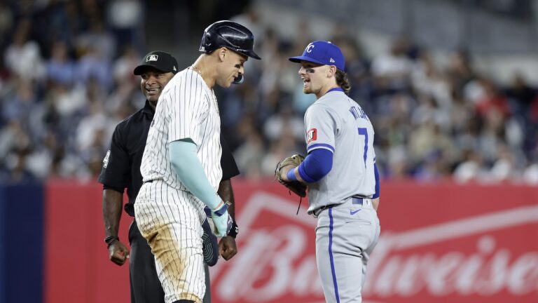Bobby Witt Jr. #7 of the Kansas City Royals in action against Aaron Judge #99 of the New York Yankees at Yankee Stadium.