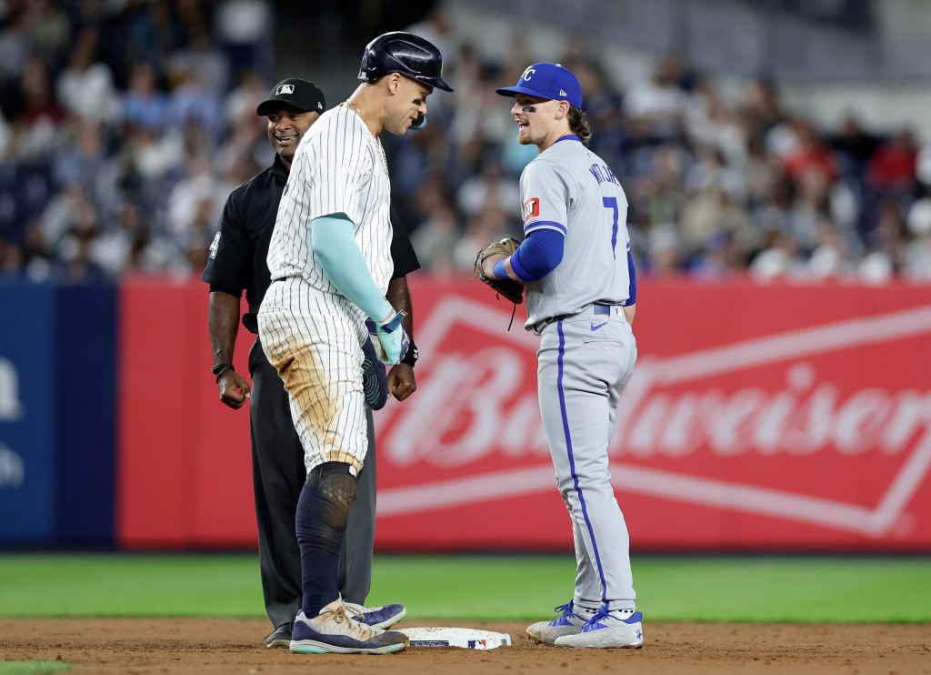 Bobby Witt Jr. #7 of the Kansas City Royals in action against Aaron Judge #99 of the New York Yankees at Yankee Stadium.