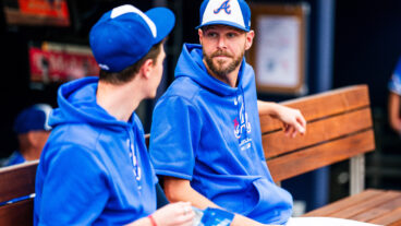 ATLANTA, GA - APRIL 20: Chris Sale #51 of Atlanta Braves talks with Max Fried #54 before the game against the Texas Rangers at Truist Park on April 20, 2024 in Atlanta, Georgia. (Photo by Kevin D. Liles/Atlanta Braves/Getty Images)