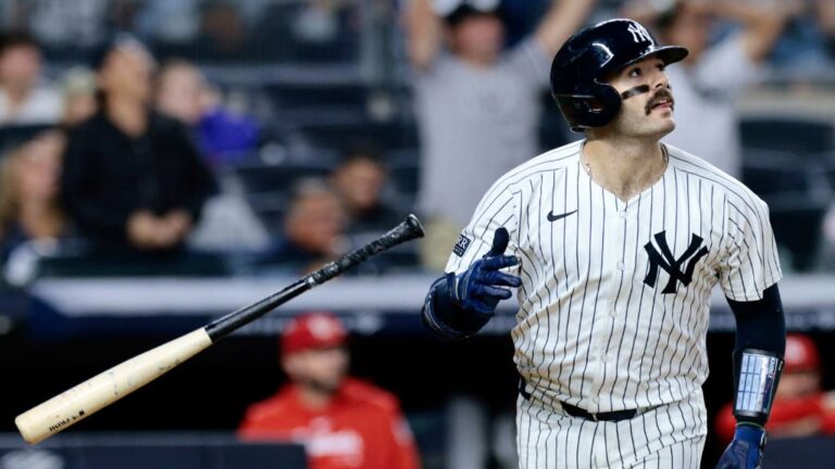Austin Wells of the New York Yankees watches his two-run homerun in the bottom of the eighth inning during the game against the St. Louis Cardinals at Yankee Stadium.