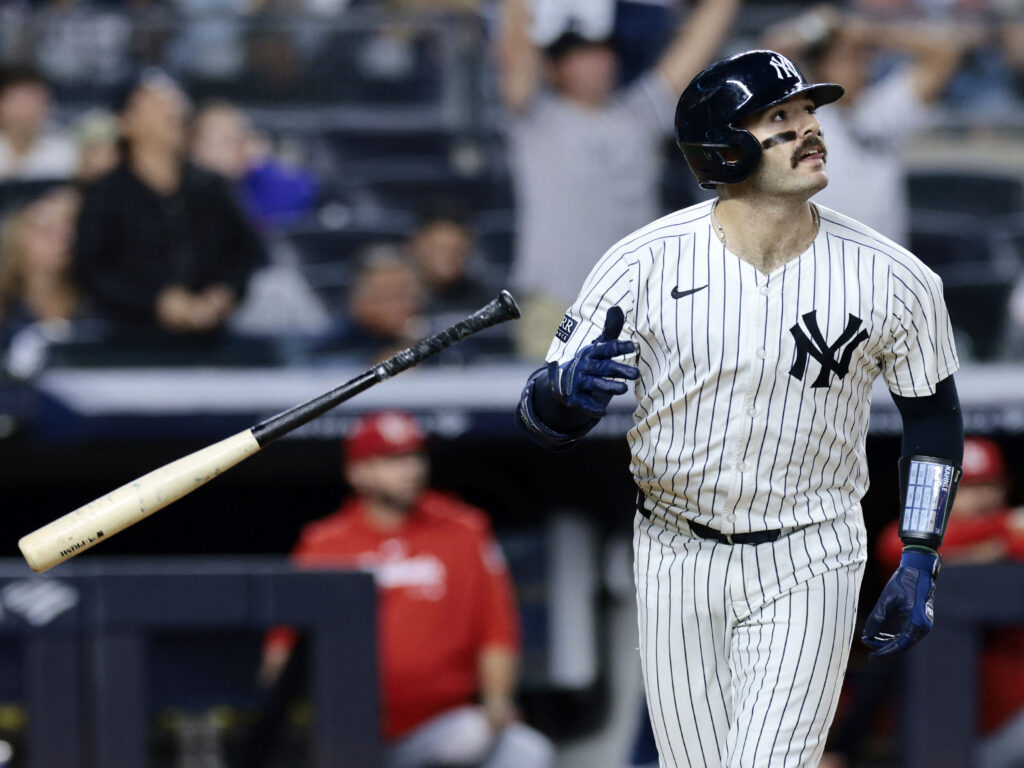 Austin Wells of the New York Yankees watches his two-run homerun in the bottom of the eighth inning during the game against the St. Louis Cardinals at Yankee Stadium.