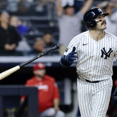 Austin Wells of the New York Yankees watches his two-run homerun in the bottom of the eighth inning during the game against the St. Louis Cardinals at Yankee Stadium.